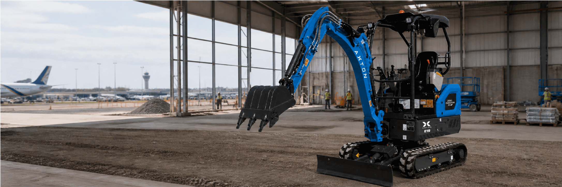 E19 electric mini excavator on a job site